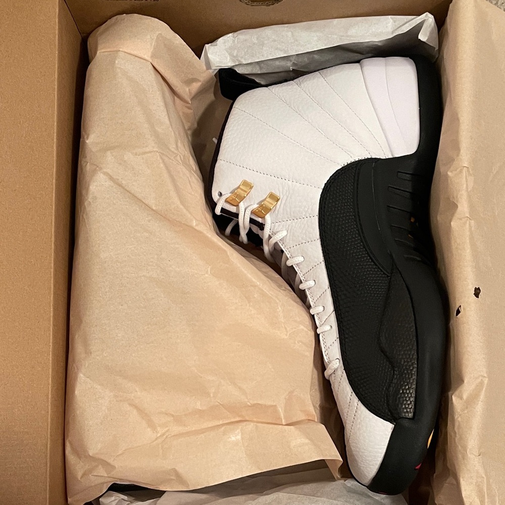 Air Jordan Taxi Black and White Sneakers with Gold Accents
